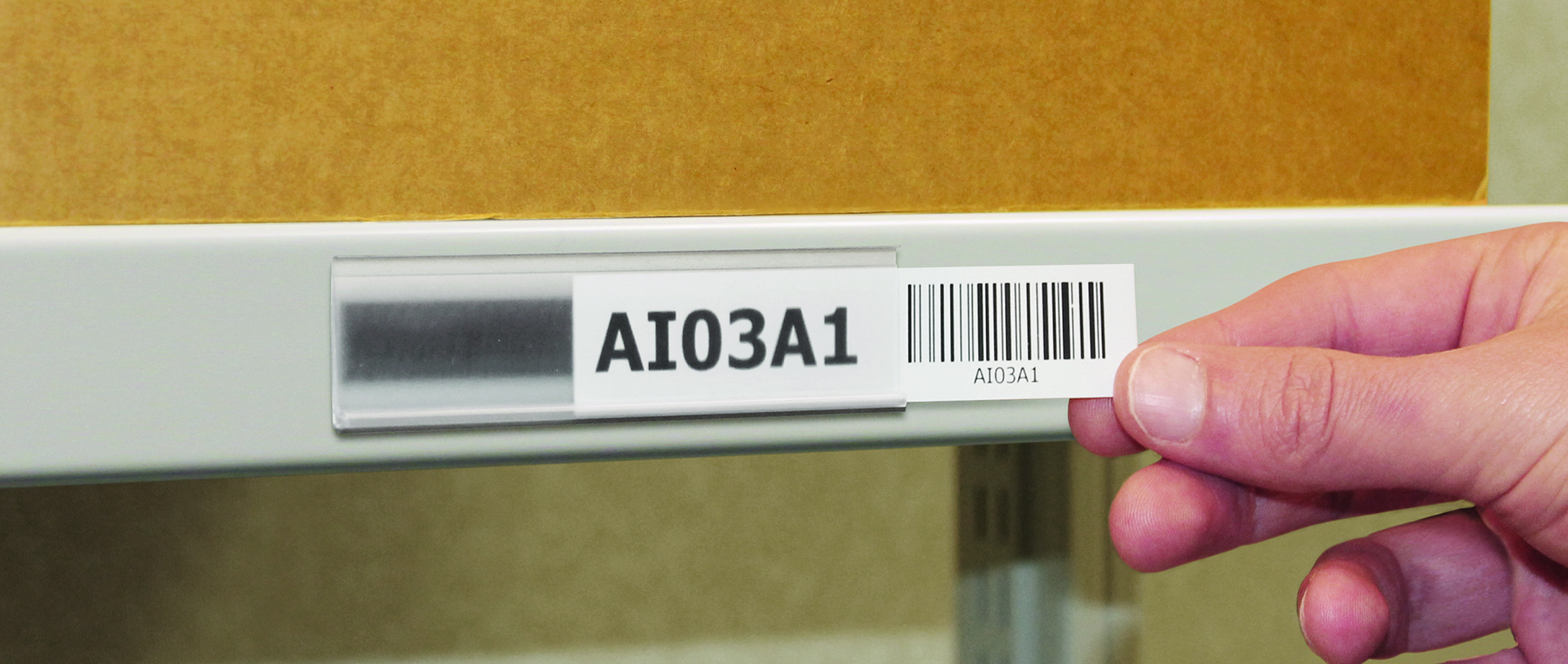 Magnetic ticket holder shown in iuse on office steel sheling for product/shelf identification
